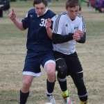 Photo by Joey Klecka/Peninsula Clarion Soldotna's Eli Sheridan (left) and Nikiski's Sam Tauriainen battle for the ball Saturday at Nikiski High School. The Stars beat the Bulldogs 9-0.