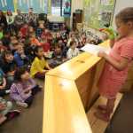 Photo by Kelly Sullivan/ Peninsula Clarion  Chloe Wendelschafer reads her Frog Important Poem Thursday, April 28, 2016, at Kalifornsky Beach Elementary, in Soldotna, Alaska.