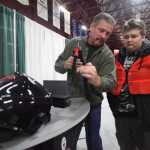 Photo by Kelly Sullivan/ Peninsula Clarion Dan Bohrnsen, work experience and work force coordinator for the Kenai Peninsula Borough School District, shows Soldotna High School student John Nicholson how to use the welding simulator during Alaska Construction Career Days Friday, April 28, 2016 at the Soldotna Regional Sports Complex.