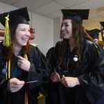 Photo by Megan Pacer/Peninsula Clarion Soldotna resident Shayna Mullins gets a quick hug just before her graduation ceremony Thursday, May 5, 2016 in the Renee C. Hernderson Auditorium at Kenai Central High School in Kenai, Alaska. Mullins graduated with her GED.