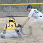 Photo by Jeff Helminiak/Peninsula Clarion Homer's Michael Swoboda beats out a double in front of the tag of Soldotna second baseman Terrance Slats on Thursday at the Soldotna Little League fields.