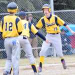 Photo by Jeff Helminiak/Peninsula Clarion Homer's Garrett Butcher celebrates a home run with Michael Swoboda in front of Joe Ravin (12) on Thursday in a game against Soldotna at the Soldotna Little League fields.