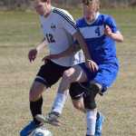 Photo by Joey Klecka/Peninsula Clarion Nikiski's Cade Anderson (12) vies for the ball against Palmer's John Burton Friday at Nikiski High School.