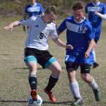 Photo by Joey Klecka/Peninsula Clarion Nikiski's XXX (L) battles for the ball with Palmer's Jeremy Houston Friday afternoon at Nikiski High School.