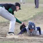 Soldotna's Caleb Spence slides underneath the tag of Colony first baseman Zachary Sattetly during a win over the Knights May 6, 2016, at the Palmer Senior Field in Palmer.
