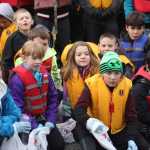 Elizabeth Walter makes sure her students are equipped for river cleanup day.