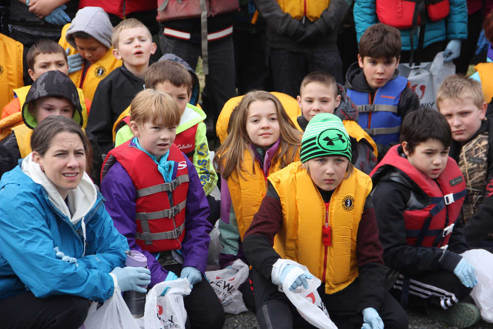 Elizabeth Walter makes sure her students are equipped for river cleanup day.