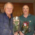 Rotarian John Davis and Rose Sale organizer Doug Schoessler.