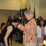 Dr. Thorsen places a CFK gold medal on this year's 1st place winners.