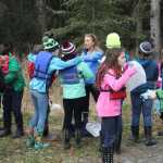 Redoubt teachers aid Sarah Spies passes out trash bags for annual student Kenai River clean up.