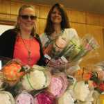 Rotarians Lara McGinnis and Becky Foster select there roses.