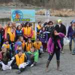 Event coordinator Cindy Glassmaker of HEA waves in another group of students.