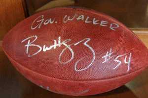 This photo taken Friday, May 6, 2016, in Anchorage, Alaska, shows a football that was presented to Alaska Gov. Bill Walker from Seattle Seahawks linebacker Bobby Wagner during an event for youth at Covenant House in Anchorage. During roughly his first year and a half in office, Walker has receives gifts ranging from alcohol to sea otter mittens to a framed photo from the King of Norway, presented by King Harald V himself. (AP Photo/Mark Thiessen)