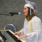 Photo by Megan Pacer/Peninsula Clarion Victoria Cizek performs the second of two songs for friends and family gathered at her graduation ceremony Sunday, May 8, 2016 at Cook Inlet Academy in Soldotna, Alaska. The school had a smaller graduating class than usual, with only four high school seniors.