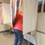 Photo by Megan Pacer/Peninsula Clarion A voter fills out her ballot during a special election Tuesday, May 10, 2016 at Soldotna City Hall in Soldotna, Alaska. The election held to decide if the city would form a charter commission saw a steady stream of voters during lunchtime hours.