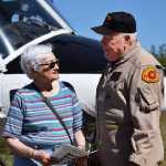 Photo by Megan Pacer/Peninsula Clarion  Kenai Keys subdivision resident Barbara Sokolov chats with Ken Carlton, a contracted helicopter pilot for the Alaska Division of Forestry, during an open house Saturday, May 14, 2016 at the division's Kenai-Kodiak Area Office in Soldotna, Alaska. A Vietnam War veteran and pilot for 47 years, Carlton has been contracted to fly during fires in Alaska for the past eight years.