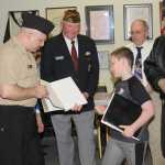 10046 Commander Anne Toutant congratulates Haedyn Horstman.