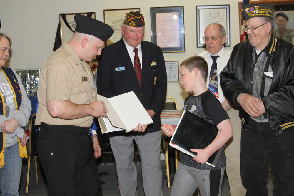 10046 Commander Anne Toutant congratulates Haedyn Horstman.