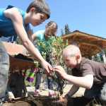 Photo by Kelly Sullivan/ Peninsula Clarion Mountain View Elementary School XXX grader and Field of Flowers gazebo for the 50th Anniversary of Alaska Arbor Day Monday, May 16, 2016, in Kenai, Alaska.