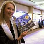 Photo by Elizabeth Earl/Peninsula Clarion Daisy Nelson hand-painted her cap for her graduation fro Soldotna High School at the Soldotna Regional Sports Complex on Wednesday, May 18, 2016. Nelson said she has been painting since she was 5 years old and intends to use her art for a career in marketing or advertising.