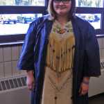 Photo by Elizabeth Earl/Peninsula Clarion Laural Schadle, a graduate from Soldotna High School, spent two and a half months hand-beading her dress with the help of her grandmother specifically for the graduation ceremony at the Soldotna Regional Sports Complex on Wednesday, May 18, 2016. Schadle said it is a family tradition to make a new dress for significant life events.