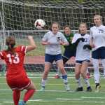 Photo by Joey Klecka/Peninsula Clarion Soldotna's Alyssa Wolfe (19), Jaela Hubbard (23) and Talon Hagen (75) form a wall in front of a free kick from Wasilla's Alexis Friesen (13), Friday at Ed Hollier Field in Kenai. SoHi goalkeeper Maddie Kindred looks on in back.