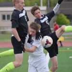 Photo by Joey Klecka/Peninsula Clarion Colony's Cade Johnstone (8) and Michael Sliwa (5) collide in the goal box with Soldotna's Eli Sheridan, Friday at Ed Hollier Field in Kenai.