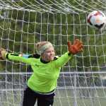 Photo by Joey Klecka/Peninsula Clarion Kenai Central senior Alli Steinbeck stretches to block a penalty kick in Saturday's Northern Lights Conference girls championship game at Ed Hollier Field in Kenai.
