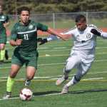 Photo by Joey Klecka/Peninsula Clarion Colony forward Alex Valdez (11) battles for possession with Kenai Central midfielder Kevin Ramos in Saturday's Northern Lights Conference championship game at Ed Hollier Field in Kenai.