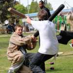 Anthony Kitson (left) fights Jacob Brewington during the Frozen Coast live-action role play group's weekly battle game on Sunday, May 22 in the Kenai Municipal Park.