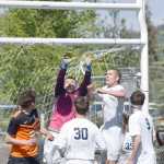 Photo by Joey Klecka/Peninsula Clarion Soldotna goalkeeper Blake Jones and teammate Timmy Smithwick rise up to meet a corner kick by West Anchorage at the ASAA state soccer tournament Thursday at Eagle River High School.