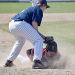 Photo by Jeff Helminiak/Peninsula Clarion Kenai Central's Paul Steffensen slides under the tag of Soldotna third baseman Jake Marcuson for a stolen base Saturday in the second-place game of the Southcentral Conference tournament at Coral Seymour Memorial Park in Kenai.