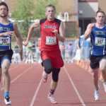 Photo by Joey Klecka/Peninsula Clarion Kenai Central junior Josh Jackman (376) makes a run to the line between two competing 100-meter sprinters Saturday at the state track and field championships at Dimond Alumni Field in Anchorage.