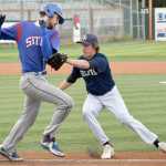 Photo by Joey Klecka/Peninsula Clarion Soldotna senior Joey Becher tags out Sitka baserunner Jesse Lantiegne in a state quarterfinal Thursday at Mulcahy Field in Anchorage.