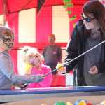 Photo by Kelly Sullivan/ Peninsula Clarion Families wave from the ferris wheel during Golden Wheel Amusements' spring carnival Sunday, June 6, 2016, in Kenai, Alaska.