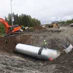 Photo by Kelly Sullivan/ Peninsula Clarion Alaska Department of Transporation employees are working around the clock to finish putting in a culvert at mile 9.8 of the Kenai Spur Highway on Monday, June 6, 2016, in Kenai, Alaska. All traffic was diverted away from the segment of roadway that was closed down entirely for the day, but is expected to open back up Tuesday morning.