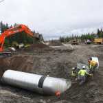 Photo by Kelly Sullivan/ Peninsula Clarion Alaska Department of Transporation employees are working around the clock to finish putting in a culvert at mile 9.8 of the Kenai Spur Highway on Monday, June 6, 2016, in Kenai, Alaska. All traffic was diverted away from the segment of roadway that was closed down entirely for the day, but is expected to open back up Tuesday morning.