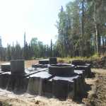 Photo by Megan Pacer/Peninsula Clarion This Wednesday, June 8, 2016 photo shows two tanks for outhouses installed in the ground at the Wolverine trailhead, part of the Tsalteshi Trails system, on just off Kalifornsky Beach Road in Soldotna. The outhouses themselves will be finished by mid September.