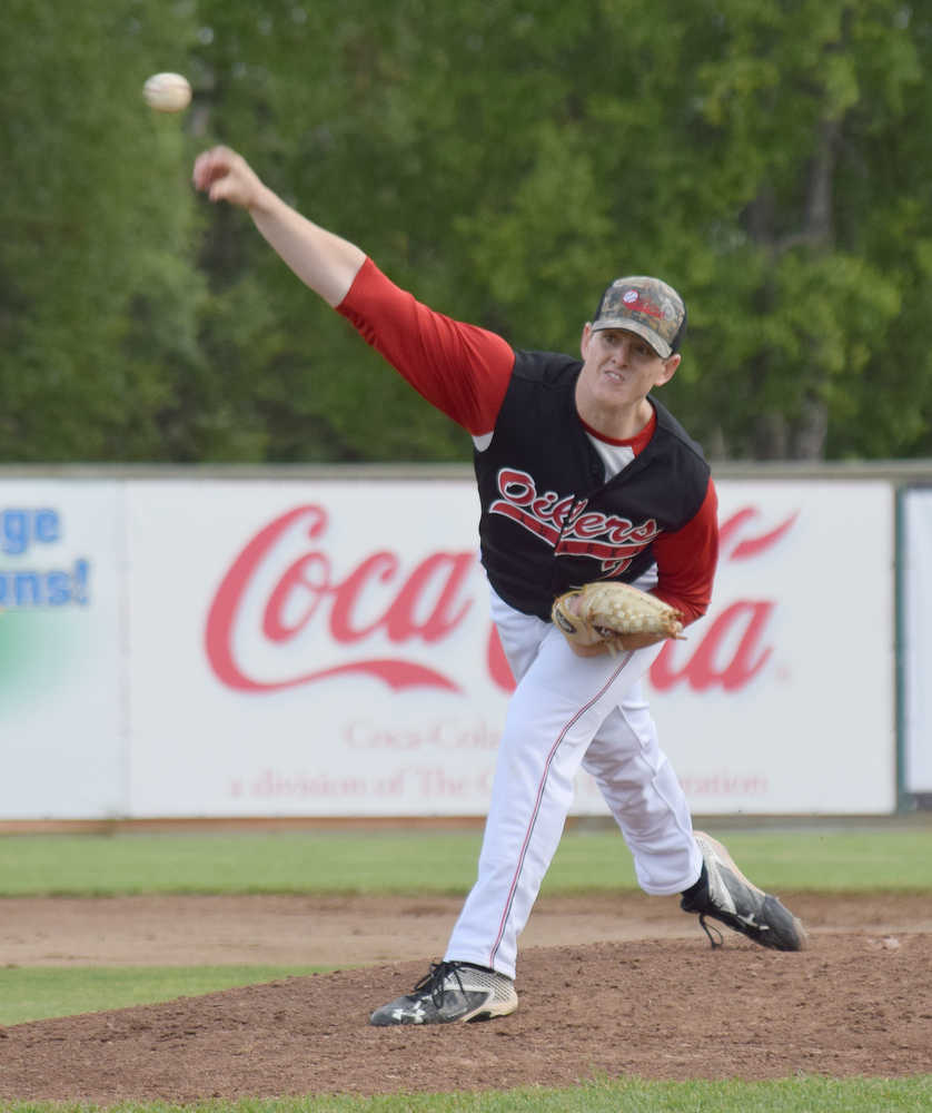 Photo by Joey Klecka/Peninsula Clarion Peninsula Oilers pitcher Billy Oxford delivers a fastball Friday evening against the Anchorage Glacier Pilots at Coral Seymour Memorial Park in Kenai.