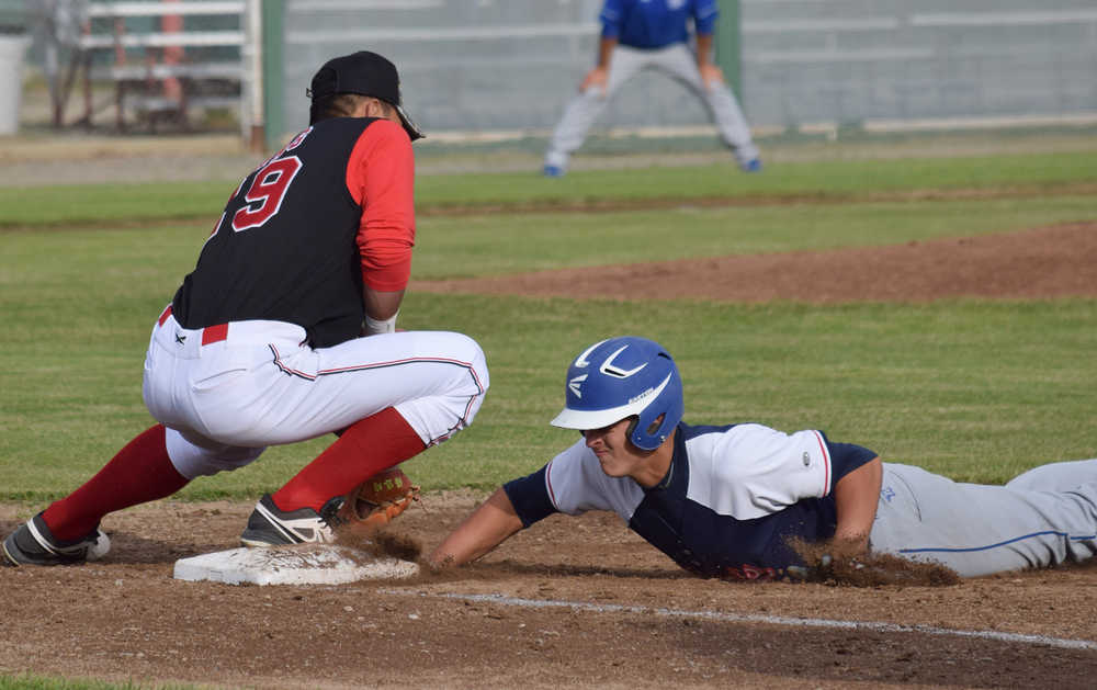 Photo by Joey Klecka/Peninsula Clarion Peninsula Oilers first baseman Shih-Tsung Wang just misses the tag on Anchorage Glacier Pilots left fielder R.J. Cordeiro, Friday evening at Coral Seymour Memorial Park in Kenai.