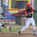 Photo by Joey Klecka/Peninsula Clarion Peninsula Oilers designated hitter Seth DeWitt (right) takes a swing against Anchorage Glacier Pilots pitcher Trent Lunsford's throw Friday evening at Coral Seymour Memorial Park in Kenai.