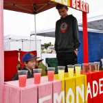 Dereck (left) and Landon Olsen staff their lemonade stand outside the Kenai Chamber of Commerce and Visitors Center on Saturday, June 11 in Kenai.