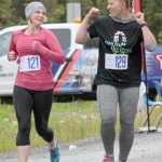 Photo by Joey Klecka/Peninsula Clarion Hope Derkevorkian (121) shares a laugh with Kimberly Glidden in Saturday's Run for the River women's 5K race in Soldotna.