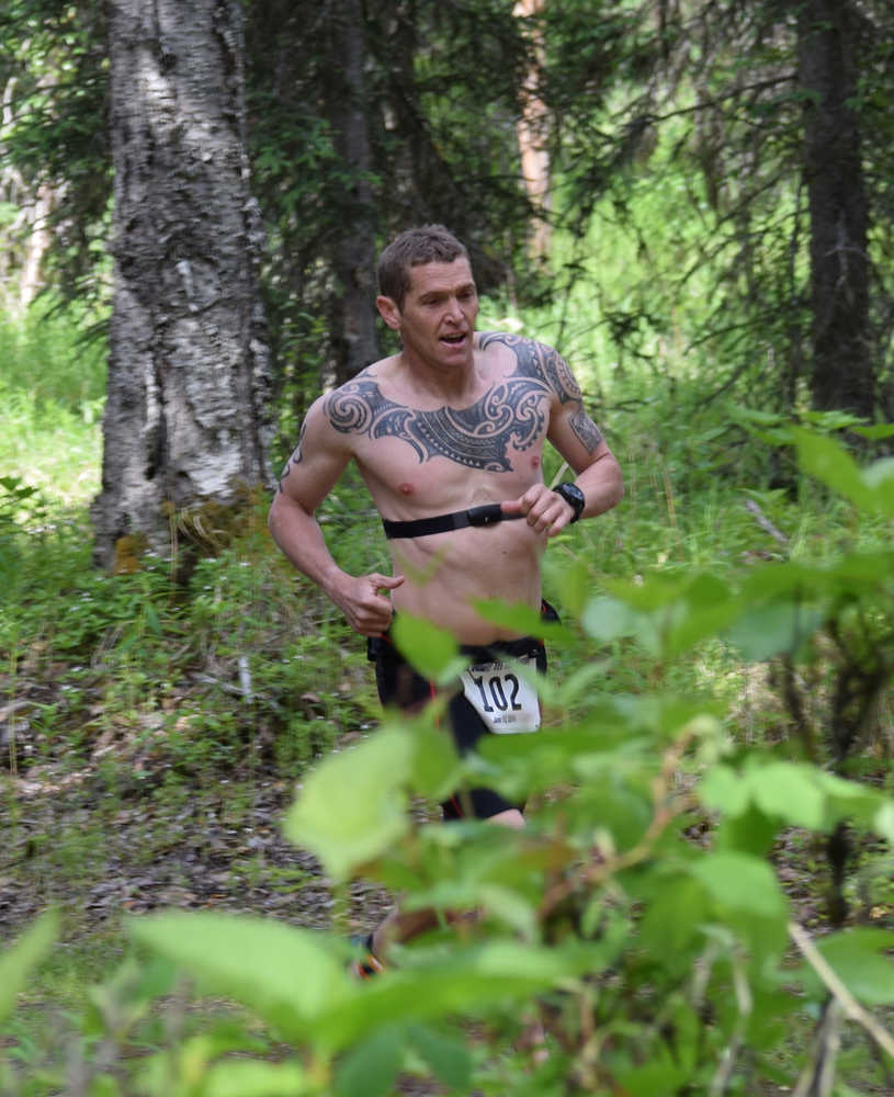 Photo by Jeff Helminiak/Peninsula Clarion Mike Crawford of Kenai does the 5-kilometer run portion of Tri the Kenai on Sunday at the Moose loop at Tsalteshi Trails.