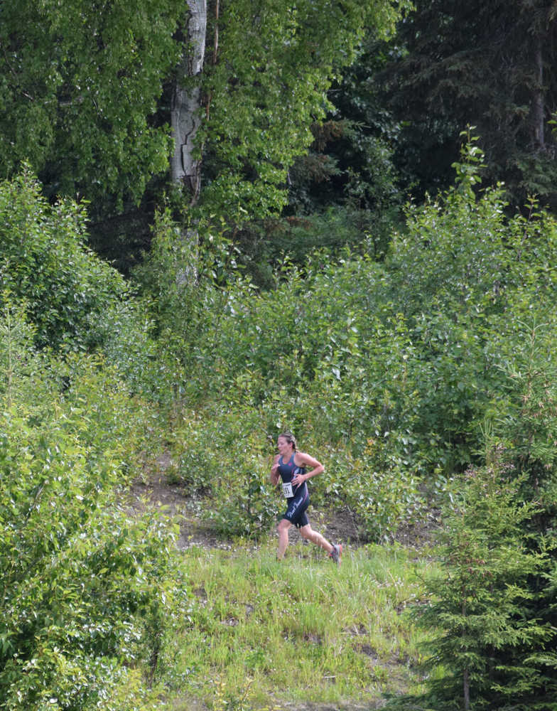 Photo by Jeff Helminiak/Peninsula Clarion Sprint competitor Ashley Tonione begins the second lap of the 5-kilometer run at Tsalteshi Trails on Sunday at the Tri the Kenai.