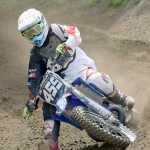 Photo by Joey Klecka/Peninsula Clarion Kraig Riese slides around a turn Saturday at the Kenai Peninsula Racing Lions motocross track in Kenai.