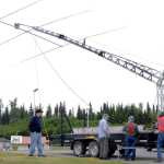 Members of the Moose Horn Amateur Radio club use a hand-cranked winch to raise a portable antennae tower from the bed of their trailer during this year's Ham Radio Feild Day on Saturday, June 25 at Skyview Middle School in Soldotna.