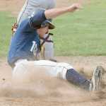 Photo by Joey Klecka/Peninsula Clarion Post 20 Twins shortstop Josh Darrow slides into home plate to score Thursday afternoon at the Kenai Little League fields.