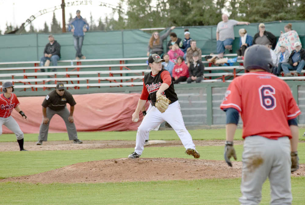 Photo by Jeff Helminiak/Peninsula Clarion Oilers starter Billy Oxford works out of a jam in the sixth inning against the Chugiak Chinooks on Friday at Coral Seymour Memorial Park in Kenai.