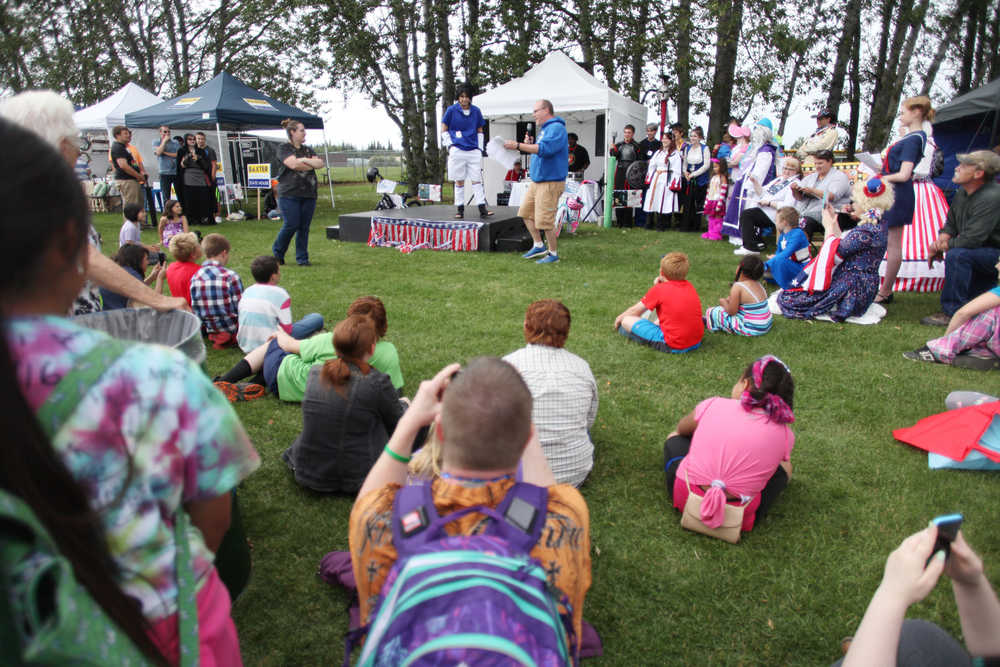 Photo by Kelly Sullivan/ Peninsula Clarion A colorful crowd watches the Kenai Performers Cosplay costume contest during the Kenai's July 4th festivities Monday, July 4, 2016 in Kenai, Alaska.